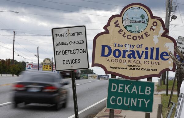 The Doraville city limits sign on Buford Highway warns of traffic enforcement. A 2014 analysis by The Atlanta Journal-Constitution revealed the cities and counties that profit most from traffic tickets. Doraville representatives said they have fair policing practices and aren’t overzealous about traffic enforcement. BOB ANDRES / BANDRES@AJC.COM