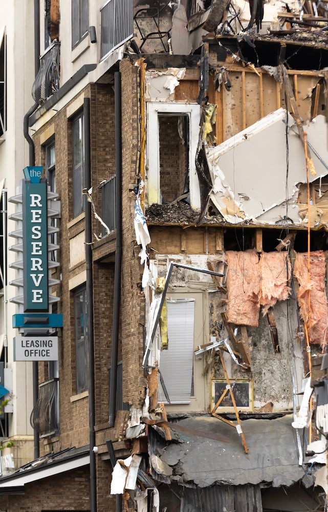 “Three weeks of knocking it down, three weeks of hauling it off. We’ll be done in six weeks,” Project Manager Vernell Burris told The Atlanta Journal-Constitution outside the building Wednesday.  (Photo by John Spink/AJC)