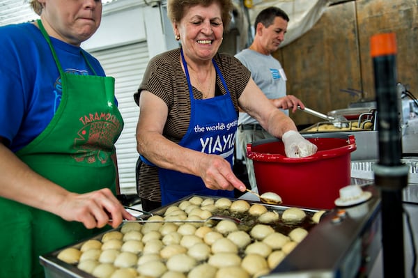 Theoni Giannakopoulos (center) makes fresh loukoumades during the Atlanta Greek Festival at the Greek Orthodox Cathedral of Annunciation on Saturday, September 26, 2015. The weekend long festival features everything Greek from food, shopping, performances, live music and tours of the church. JONATHAN PHILLIPS / SPECIAL