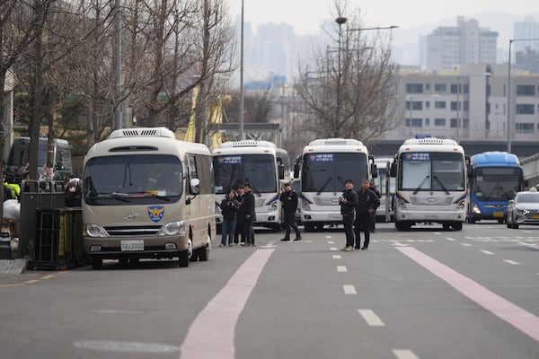 Police buses are gathered near the presidential residence in Seoul, South Korea, Friday, March 7, 2025. (AP Photo/Lee Jin-man)