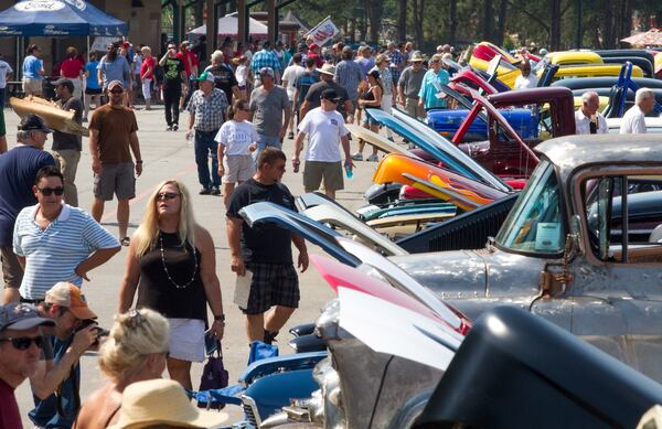 A crowd looks over the many cars on display during the 28th annual Creepers Car Show at Jim R. Miller Park in Marietta on Saturday. STEVE SCHAEFER / SPECIAL TO THE AJC