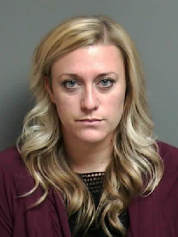 Michigan high school teacher Lydia Johnson is charged in connection with the theft of thousands of dollars in school funds to allegedly feed her gambling addiction.