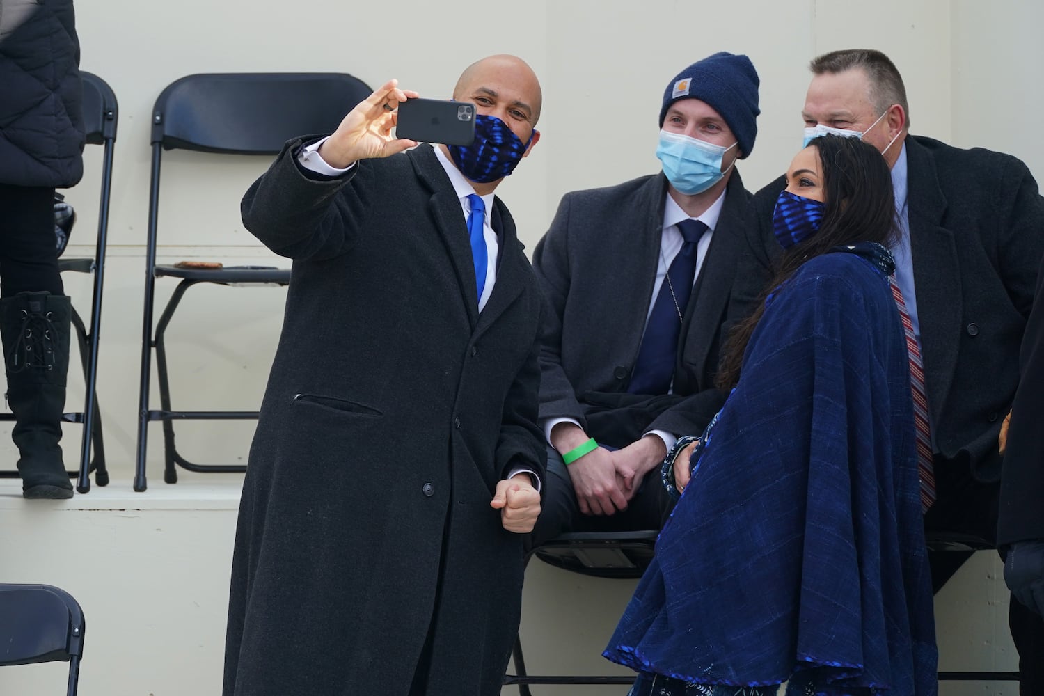 Sen. Cory Booker (D-N.J.) takes selfies with Rosario Dawson and others before the inauguration ceremony of Joe Biden at the Capitol in Washington on  Wednesday, Jan. 20, 2021. (Erin Schaff/The New York Times)