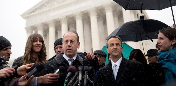 Paul Clement, lawyer arguing before the U.S. Supreme Court on behalf of Hobby Lobby Stores Inc. and Conestoga Wood Specialties Corp., center, speaks to the media with David Cortman, senior counsel and vice-president of religious liberty with Alliance Defending Freedom, right, following arguments in Washington, D.C., U.S., on Tuesday, March 25, 2014. A divided U.S. Supreme Court debated whether companies can assert religious rights, hearing arguments in an ideological clash over President Barack Obama's health care law and rules that promote contraceptive coverage.