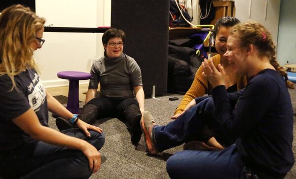 Martha, left center, Katina Thompson, left, and Trina Bacon, right center, laugh with a student as she points out that her shoe is considered a wedge at the Ellis Center in Decatur. She is an advocate for students everywhere to get the support they need. She has a life map, where she’s written down everything she’d like to accomplish, many of them including advocacy and helping others, and she is well on her way.EMILY HANEY / emily.haney@ajc.com