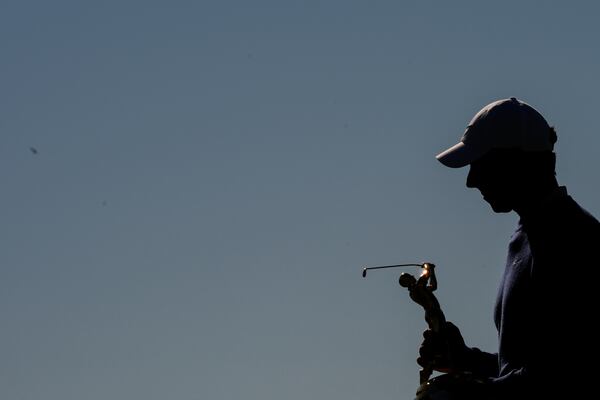 Rory McIlroy, of Northern Ireland, leaves a trophy ceremony after winning a playoff round of The Players Championship golf tournament Monday, March 17, 2025, in Ponte Vedra Beach, Fla. (AP Photo/Julia Demaree Nikhinson)