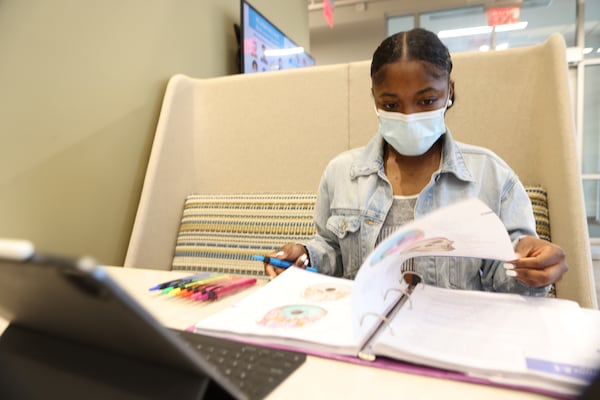 Chattahoochee Technical College student Jamaalriya Parker, 22, gets some study time at a common area on campus. Two years ago, Parker was a sophomore at the University of Alabama in Huntsville. When COVID-19 hit, the town shut down and she returned home to Atlanta. (P Miguel Martinez for The Atlanta Journal-Constitution