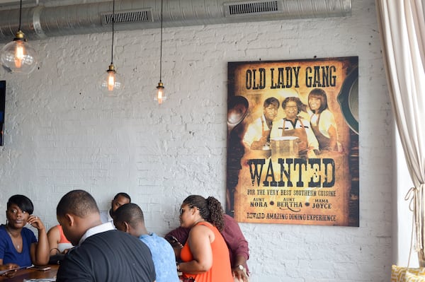 Photos of the members of the self-described Old Lady Gang are never far from view, and they are the mother and the aunts of “Real Housewives of Atlanta” star Kandi Burruss, who launched the restaurant with her husband. CONTRIBUTED BY HENRI HOLLIS