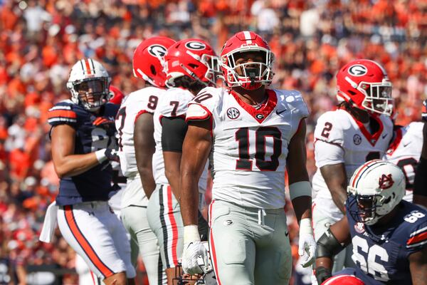 Georgia linebacker Jamon Dumas-Johnson (10) celebrates a defensive play during the first half against Auburn at Jordan-Hare Stadium, Saturday, September 30, 2023, in Auburn, Al. Georgia won 27-20. Pollack’s mind was racing about the Georgia-Ole Miss matchup. With Jamon Dumas-Johnson expected to miss today's game, Pollack said he's worried about the Dawgs' ability to stop the Rebels' offense, (Jason Getz / Jason.Getz@ajc.com)