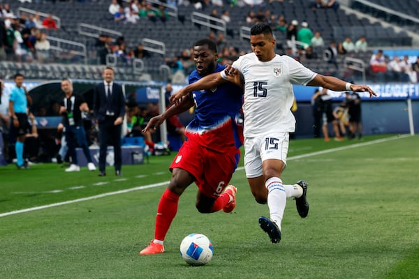 United States' Yunus Musah, left, vies for the ball against Panama's Jorge Gutierrez Cornejo (15) during the first half of a CONCACAF Nations League semifinal soccer match Thursday, March 20, 2025, in Inglewood, Calif. (AP Photo/Etienne Laurent)