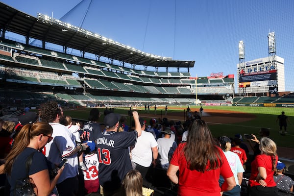 Atlanta Braves fans show their support during the Atlanta Braves post season workout in preparation for the MLB Playoffs at Truist Park, Tuesday, October 3, 2023, in Atlanta. The Braves first playoff game will be on Saturday, Oct. 7, 2023 at Truist Park for game one of the NLDS. (Jason Getz / Jason.Getz@ajc.com)