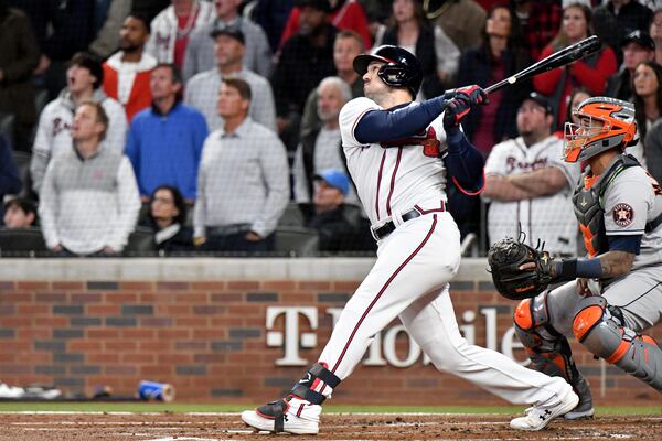 Braves center fielder Adam Duvall hits a grand slam home run to put the Braves up 4-0 during the first inning against the Houston Astros in game 5 of the World Series at Truist Park, Sunday, October 31, 2021, in Atlanta. Hyosub Shin / Hyosub.Shin@ajc.com