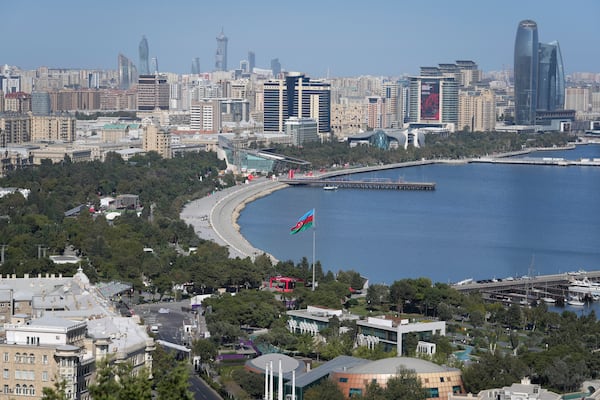 An Azerbaijan flag is displayed near Baku Bay, in Baku, Azerbaijan, Monday, Sept. 16, 2024. (AP Photo/Sergei Grits)