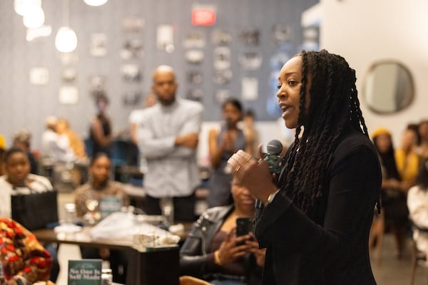 Lakeysha Hallmon speaks at her book launch event for “No One is Self-Made” at The Gathering Spot in Atlanta on Friday, February 7, 2025. (Arvin Temkar / AJC)