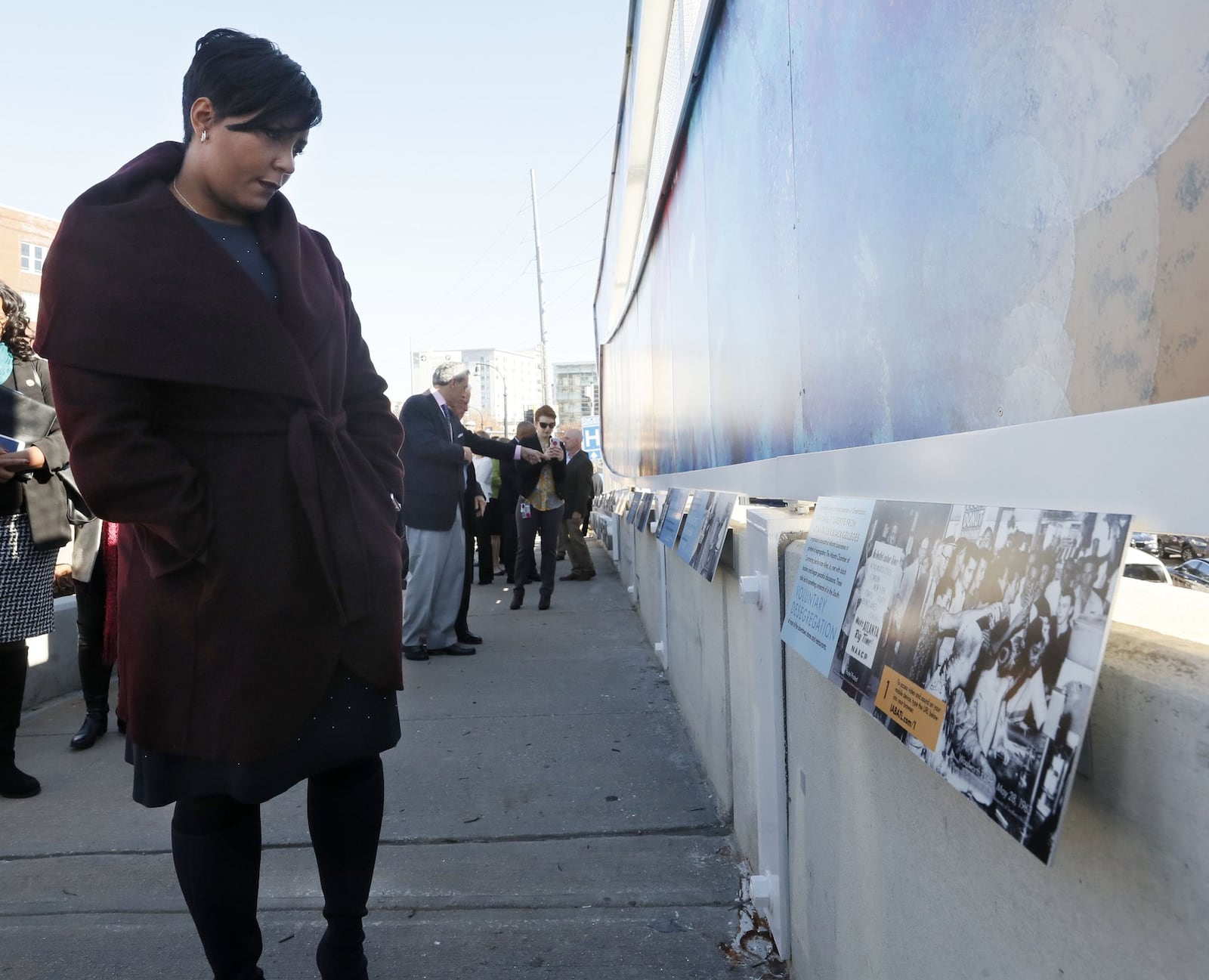 November 25, 2019 - Atlanta - Atlanta Mayor Keisha Lance Bottoms views a timeline of the history of Atlanta under Mayor Ivan Allen Jr. that lines the bridge. The PATH Foundation dedicated the bridge to former Atlanta Mayor Ivan Allen Jr. The Ivan Allen Gateway creates a trail connection from Centennial Park to the westside, and serves as a memorial to Mayor Ivan Allen Jr. Bob Andres / robert.andres@ajc.com