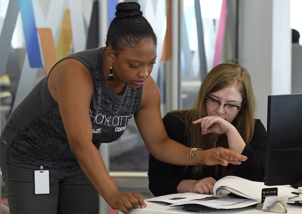 Shayla McNair, founder of Shay Latte Coffee, and Katie Culp, founder of tulipcake EMBROIDERY, left to right, collaborate at the Women’s Entrepreneurship Initiative office on Tuesday, September 4. Jenna Eason / Jenna.Eason@coxinc.com