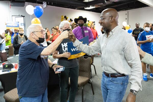 Senator Raphael Warnock greats the crowd during a rally in Atlanta, GA, on Saturday, July 23, 2022.  on Saturday, July 23, 2022.   (Bob Andres for the Atlanta Journal Constitution)