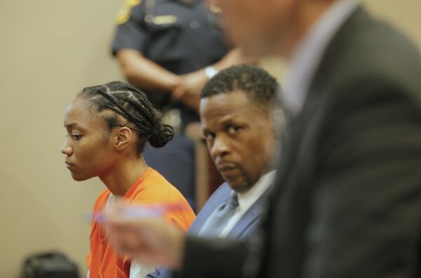 Dijanelle Fowler, left, sits in a preliminary hearing on Aug. 3, 2017.