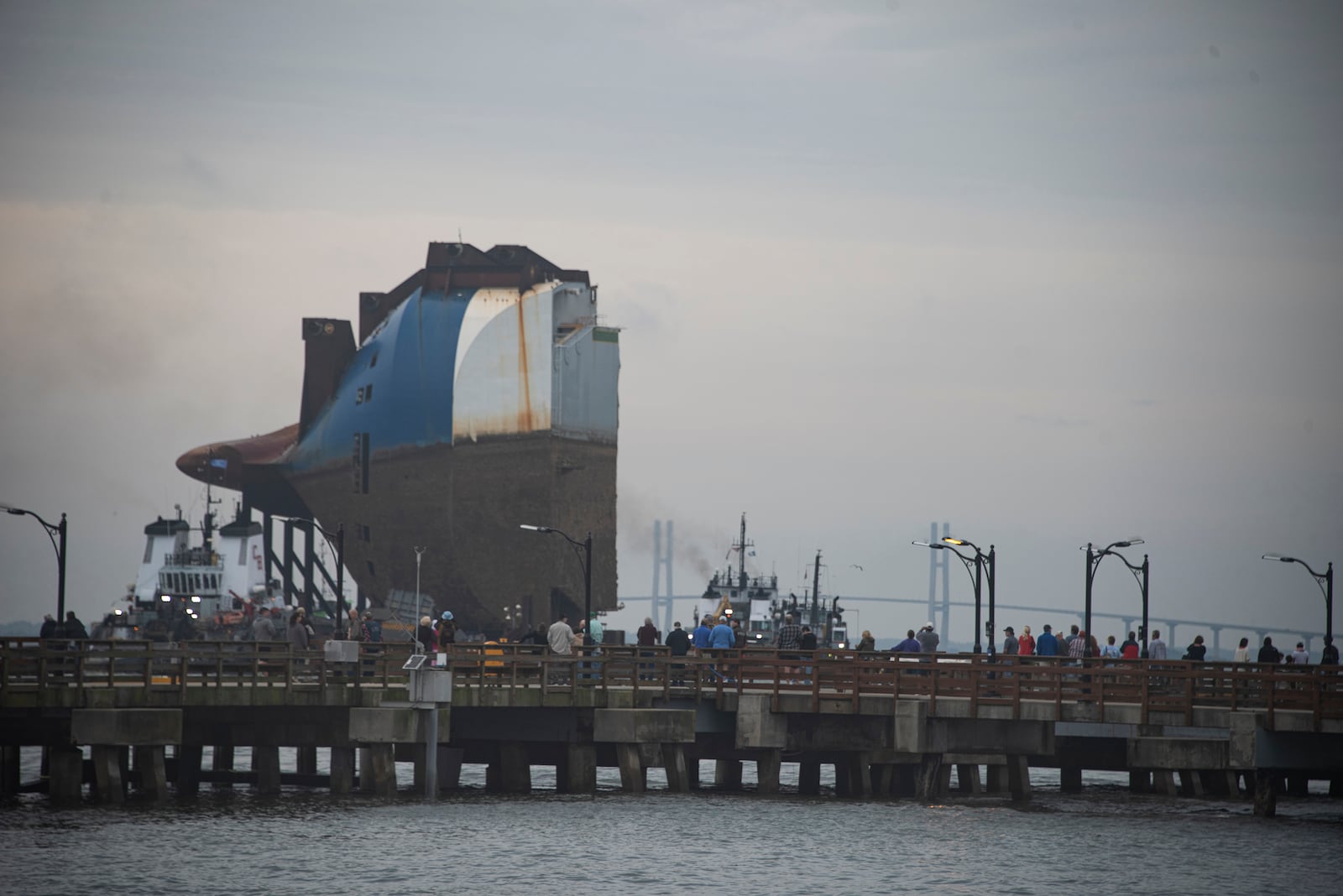 Section One loaded on the Barge JULIE B travels passes St. Simons Pier enroute to a local site to be secured for transit at sea.