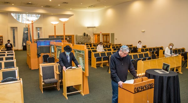 Congregation Beth Tefillah now allows some in person worship where Dr. Daniel Goodman leads services and Rabbi Yossi New gets the Zoom connected at the Orthodox temple in Sandy Springs on Thursday, March 11, 2021.  Masks are required, unless leading services, seating is limited and zoom is allowed during the week. Saturday sabbath remains free of technology and tented outdoor space has been added for fellowship.  (Jenni Girtman for The Atlanta Journal-Constitution) 