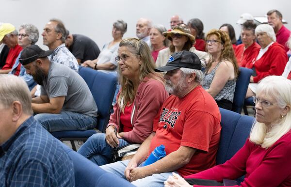 Audience members react as the Morgan County board of assessors vote to approve the Rivian tax exemption proposal in Madison on Wednesday, May 25, 2022.   (Bob Andres / robert.andres@ajc.com)