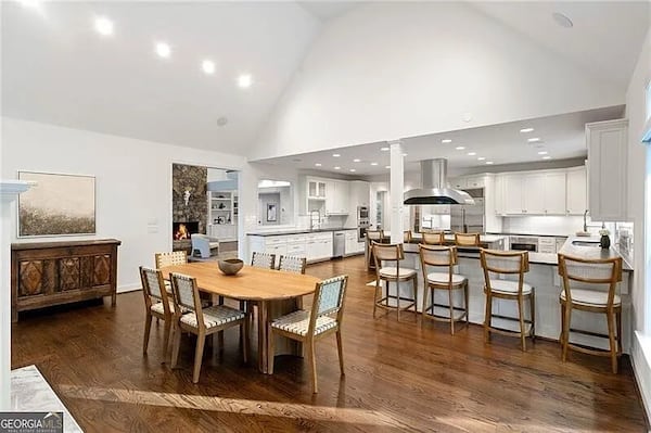 The kitchen "overlooks an open-concept vaulted living room and a fireside breakfast room," according to the listing. (Courtesy of Ansley/Christie's)