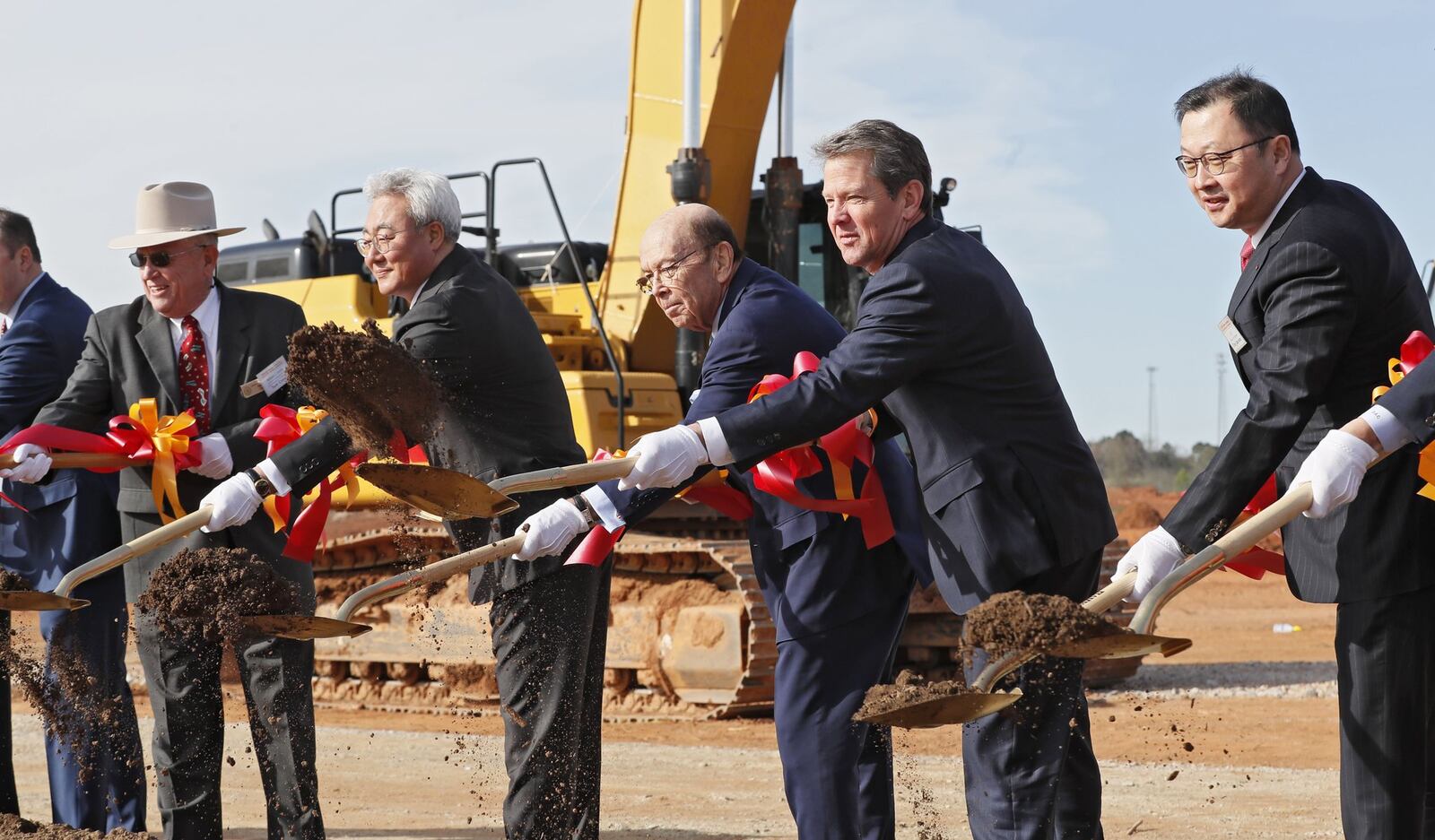 March 19, 2019 - Atlanta - SK Innovation President and CEO Jun Kim, left, U.S. Secretary of Commerce Wilbur Ross, Gov. Brian Kemp, and Jaewon Chey, SK Group Executive Vice Chairman, joined in a groundbreaking ceremony for a new battery factory in Jackson County Bob Andres / bandres@ajc.com