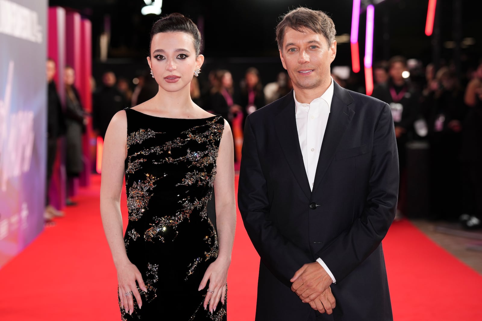 Mikey Madison, left and director Sean Baker pose for photographers upon arrival at the premiere of the film 'Anora' during the London Film Festival on Friday, Oct. 11, 2024, in London. (Photo by Scott A Garfitt/Invision/AP)