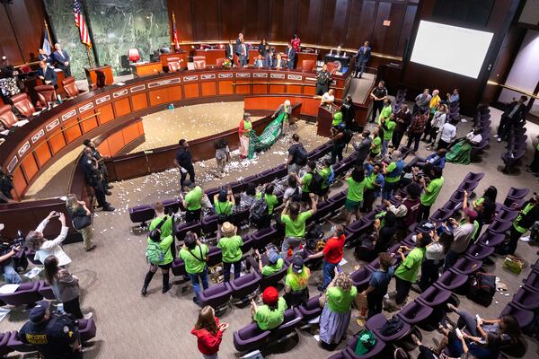 Opponents of the under-construction law enforcement training center known to some as Cop City disrupt the City Council meeting at City Hall in Atlanta on Monday, September 16, 2024. It’s been one year since opponents submitted a petition to force a referendum to block the project. (Arvin Temkar / AJC)