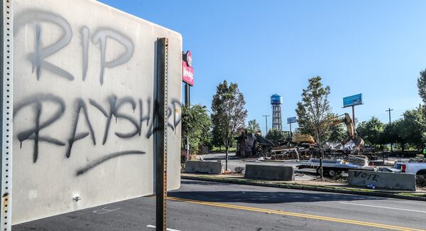 The Wendy’s where Rayshard Brooks was killed by Atlanta police in June was torn down on July 14, 2020. Construction crews used an excavator to demolish the charred remains of the University Avenue restaurant. JOHN SPINK/JSPINK@AJC.COM

