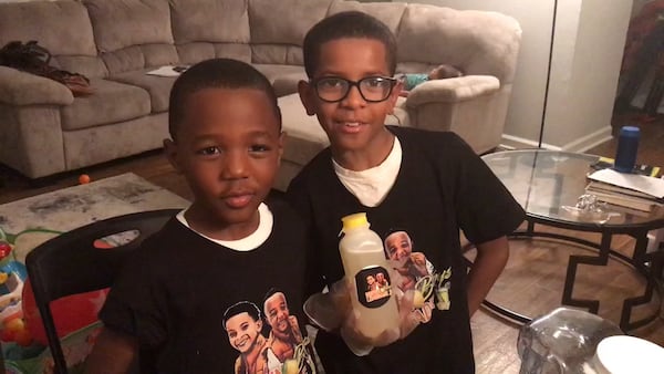 Ja’Den St. Hilaire (left), 7, and his brother Anthony Roberson, 10, are the owners of Brown Boys Lemonade. Roberson started out in 2013 with a lemonade stand to earn money for a video game. This fall, the brothers began bottling their beverage. (Photo by Ligaya Figueras)