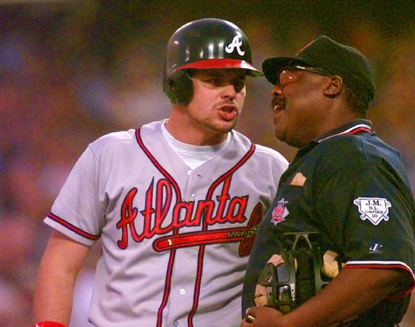 Atlanta Braves Ryan Klesko argues with home plate umpire Eric Gregg after being called out on strikes during their play-off game against the Los Angeles Dodgers at Dodger Stadium in Los Angeles, Thursday, Oct. 3, 1996. (AP Photo/Michael Caulfield)