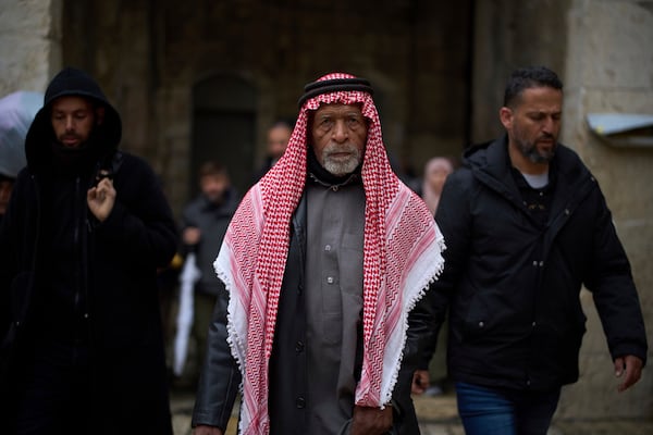 A Muslim worshipper makes his way to the Al-Aqsa Mosque compound for the Friday prayers of the Muslim holy month of Ramadan in the Old City of Jerusalem, Friday, March 7, 2025. (AP Photo/Leo Correa)