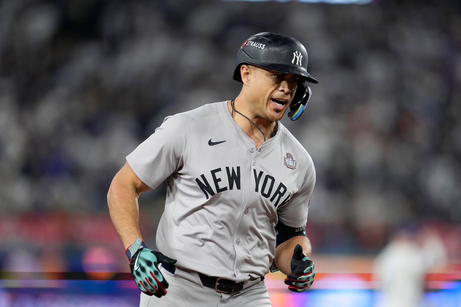 New York Yankees' Giancarlo Stanton runs the bases after hitting a two-run home run against the Los Angeles Dodgers during the sixth inning in Game 1 of the baseball World Series, Friday, Oct. 25, 2024, in Los Angeles. (AP Photo/Godofredo A. Vásquez)