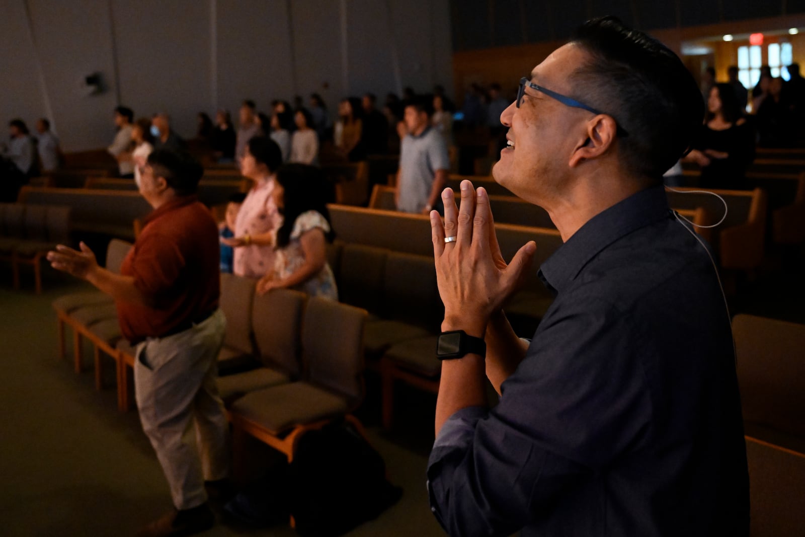 Pastor Owen Lee prays during a service at the Christ Central Presbyterian Church, Sunday, Oct. 13, 2024 in Centreville. (AP Photo/John McDonnell)