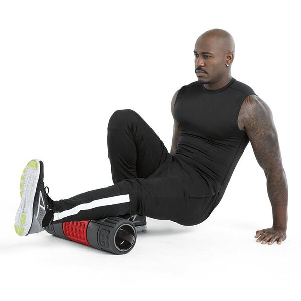 Dolvett demonstrates a way to use his new foam roller. CREDIT: Brookstone