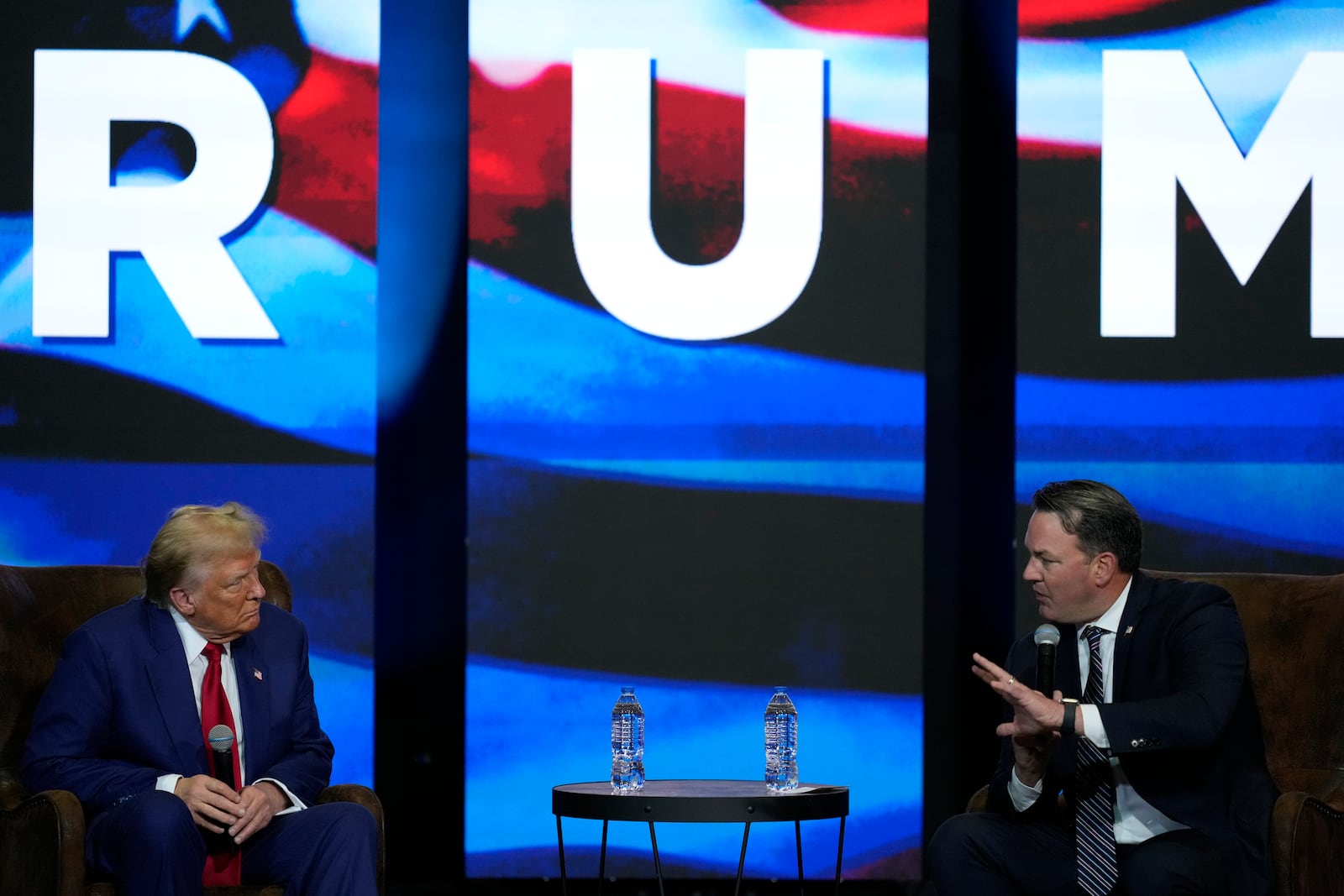 Republican presidential nominee former President Donald Trump (left) listens during a faith town hall with Georgia Lt. Gov. Burt Jones at Christ Chapel Zebulon on Wednesday, Oct. 23, 2024, in Zebulon. (Julia Demaree Nikhinson/AP)