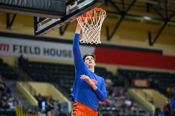 FILE - Florida center Olivier Rioux warms up before an NCAA college basketball game against Wake Forest, Thursday, Nov. 28, 2024, in Kissimmee, Fla. (AP Photo/Phelan M. Ebenhack, File)