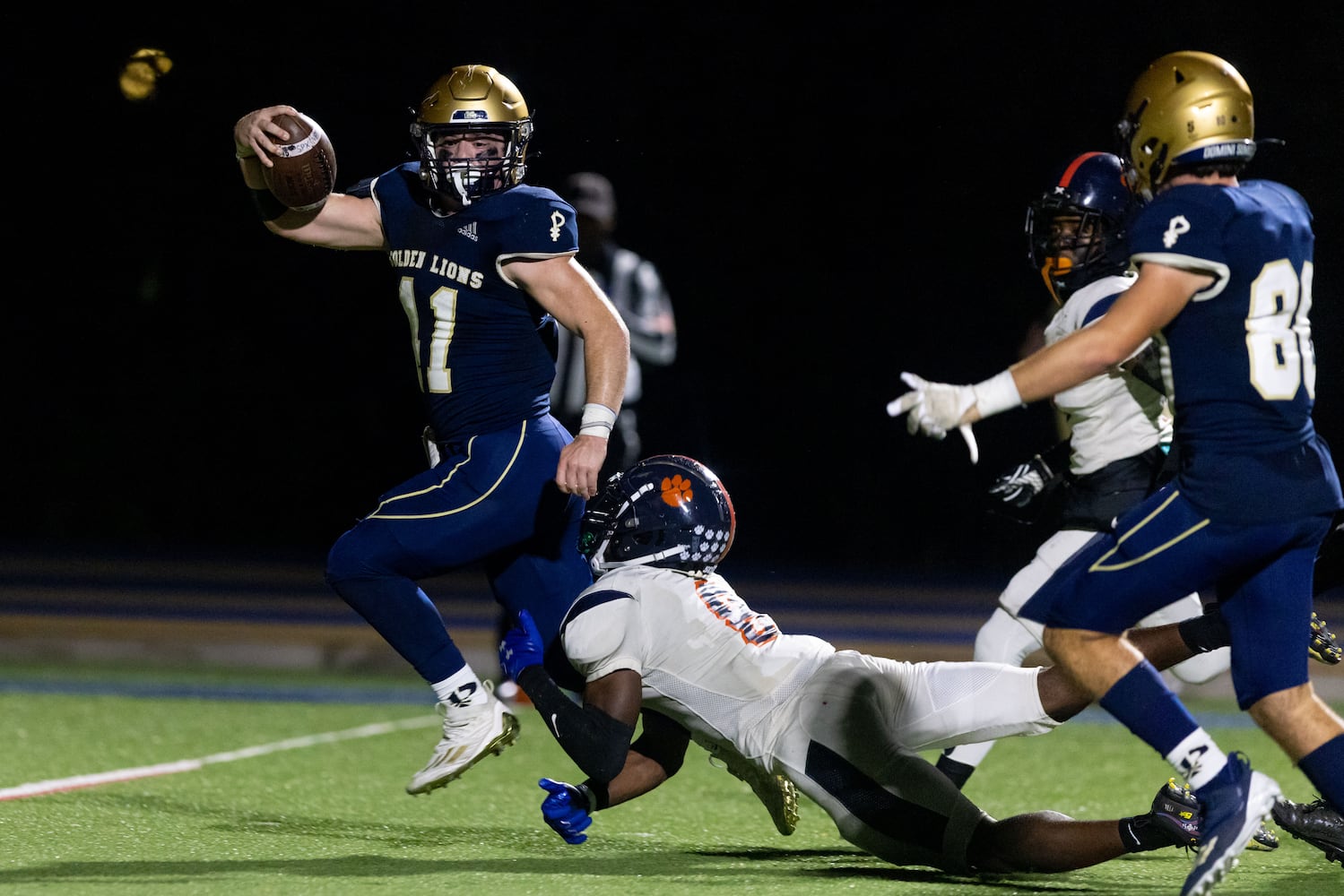 St. Pius’s Joseph Brewster (11) scores a touchdown against  Mundy’s Mill at St. Pius Catholic School in Atlanta on Friday, November 11, 2022. St. Pius won 27-21. (Photo/Jenn Finch)