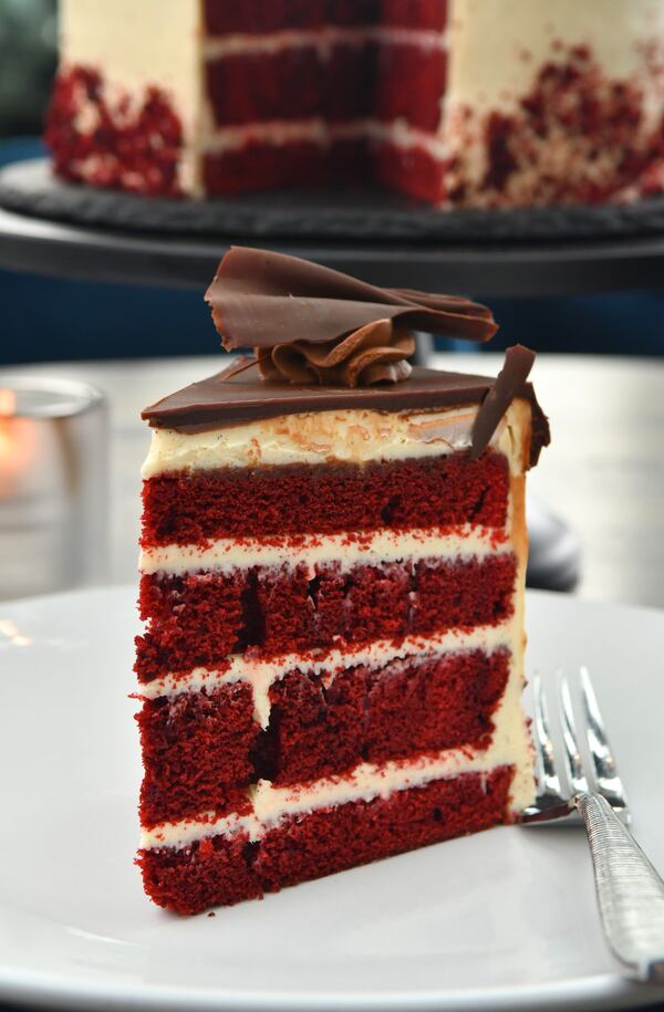 Red Velvet Cake with Cream Cheese Frosting and Chocolate Glaze is a tasty way to celebrate Valentine's Day. (Styling by 5Church's executive pastry chef Ben Collins / Chris Hunt for the AJC)