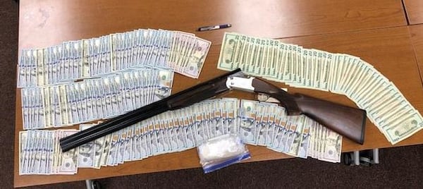 Investigators seized methamphetamine, a large amount of cash and a shotgun after arresting a father and son at a Maysville home.