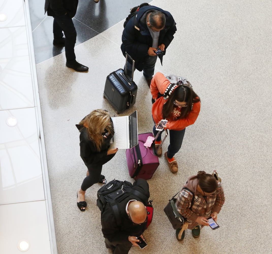 PHOTOS: Atlanta airport travelers stuck in long TSA wait lines