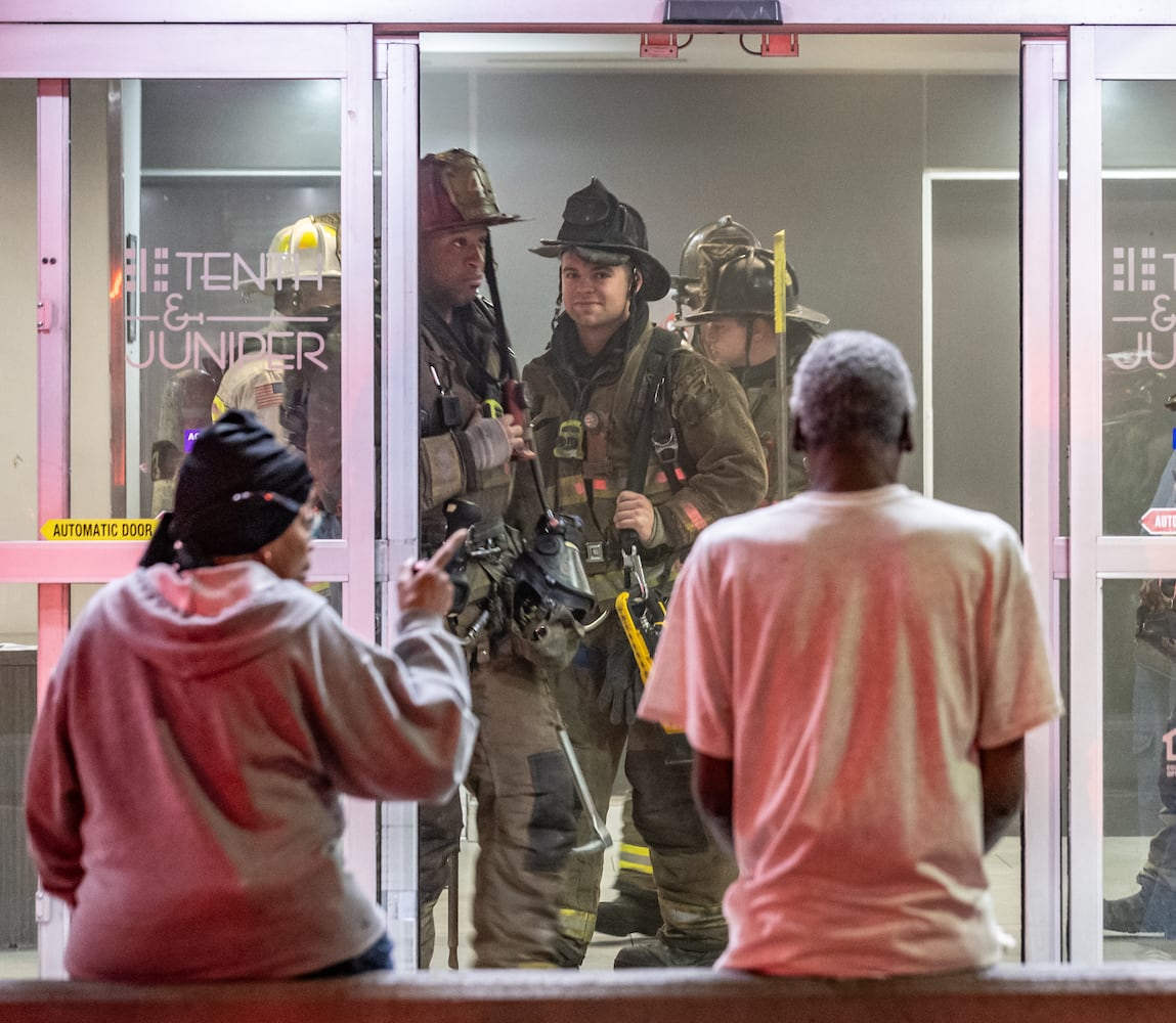 A fire in a trash chute of a Midtown Atlanta high-rise for seniors prompted the evacuation of its lower floors Wednesday, March 13, 2024. Atlanta fire Battalion Chief Michael Roman said crews were called to the 10th & Juniper building near Piedmont Park around 6:30 a.m. and found smoke on the fourth floor coming from the trash chute. Firefighters then went into the basement and found an active fire in the trash compactor, he said. Additional units were called, and the fire was quickly extinguished. About 30 to 40 residents were evacuated from the lower half of the building on floors that had light smoke, Roman said. The smoke was quickly ventilated out. Only one resident was treated on scene for smoke inhalation, Roman said. (John Spink / John.Spink@ajc.com)