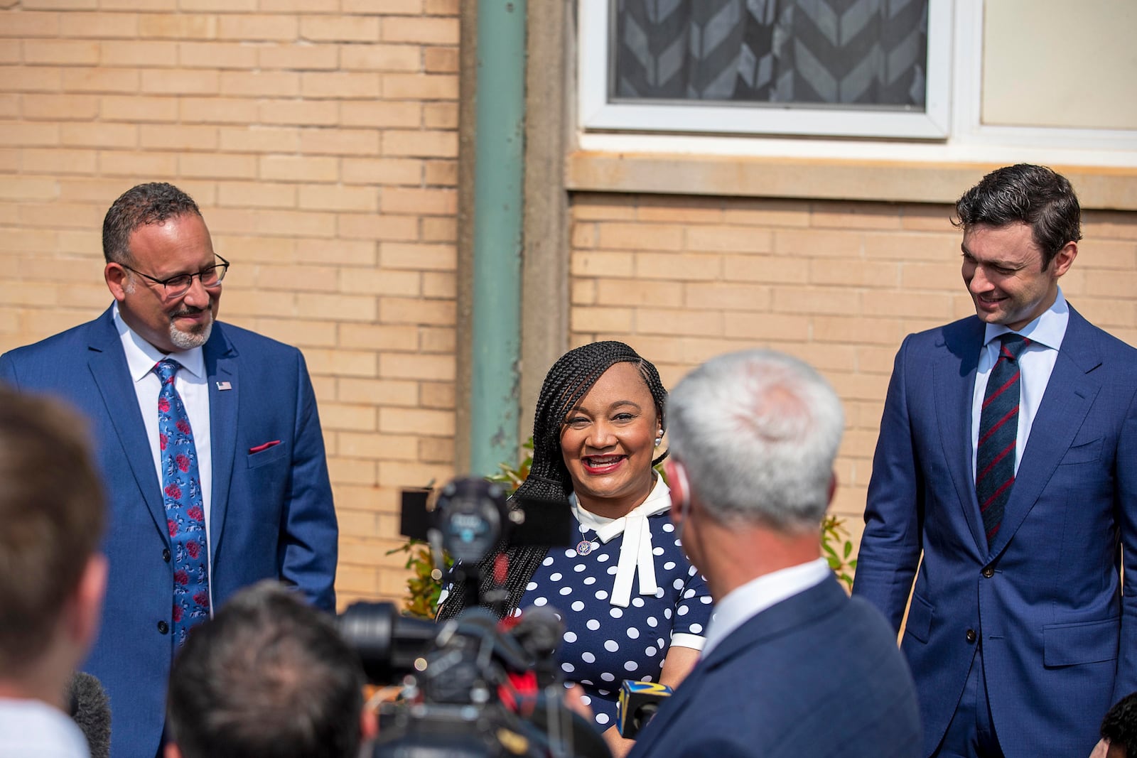 07/23/2021 — Decatur, Georgia — U.S. Congresswoman Nikema Williams, center, makes remarks during a joint presser with U.S. Senator Jon Ossoff ,right, and U.S. Secretary of Education Miguel Cardona, left, following a tour and visit to Kelley Lake Elementary School in Decatur, Friday, July 23, 2021. (Alyssa Pointer/Atlanta Journal Constitution)