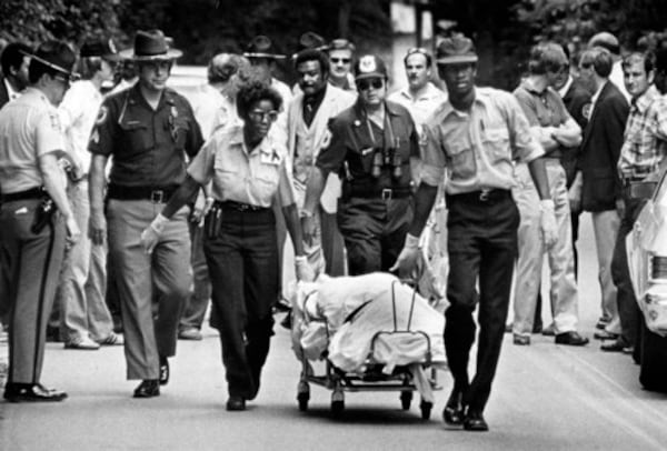 Ambulance attendants move the body of Nathaniel Cater from the Chattahoochee River in this 1981 photo. Police staked out the South Cobb Drive bridge over the river and heard a splash on May 22, 1981. Shortly thereafter a white 1970 Chevrolet station wagon driven by Wayne Williams was seen slowly driving away. Dog hair and fiber evidence in the vehicle would be a major factor in building the case against Williams.