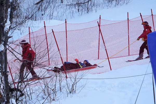 Mikaela Shiffrin, of the United States, is taken down the mountain on a sled by ski patrol after crashing during the second run of a women's World Cup giant slalom skiing race, Saturday, Nov. 30, 2024, in Killington, Vt. (AP Photo/Robert F. Bukaty)