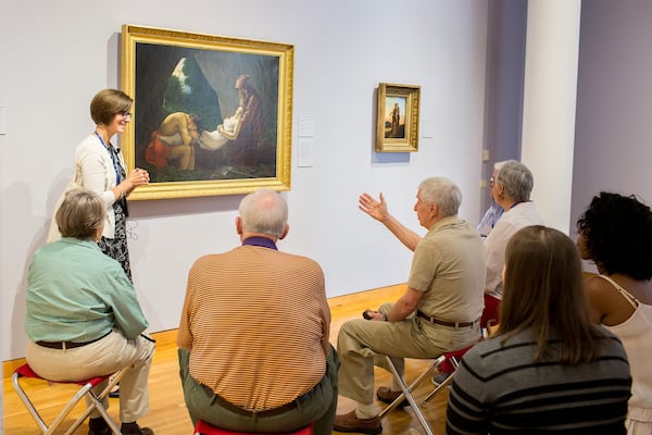 Amanda Williams, an artist and art educator at the High Museum of Art, leads a “Musing Together” art tour designed for people in the early stages of dementia and their care partners. “We just want them to come and enjoy themselves,” Williams said.  