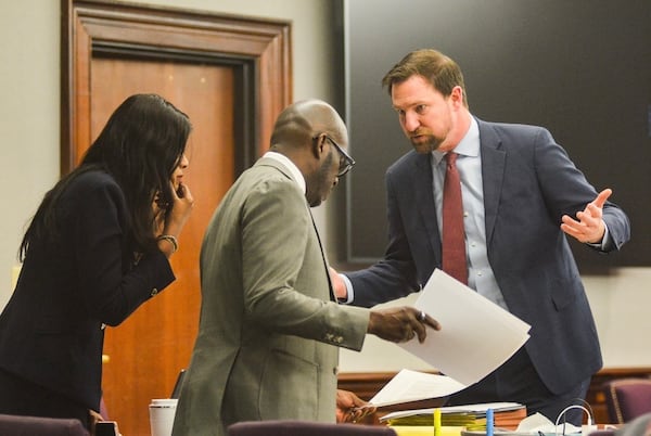 Prosecutor John Fowler, right, speaks with Jackie Johnson's defense team during jury selection Monday at the Glynn County Courthouse. Terry Dickson/The Brunswick News