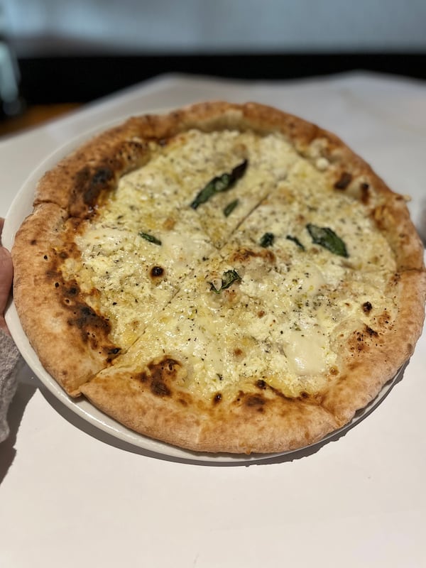 Amalfi's quattro formaggio features fresh mozzarella, fontina, pecorino romano and goat cheese. Angela Hansberger for The Atlanta Journal-Constitution