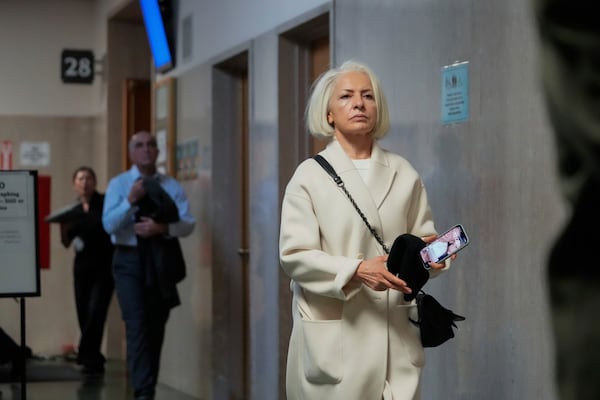 Mahnaz Tayarani, mother of Nima Momeni – who is charged with murder in Cash App founder Bob Lee's stabbing death – walks out of the courtroom at the Hall of Justice for Momeni's murder trial Monday, Dec. 2, 2024, in San Francisco. (AP Photo/Godofredo A. Vásquez)